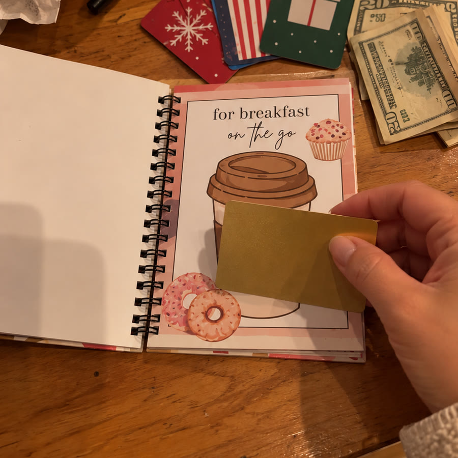 Taping a gift card into the book